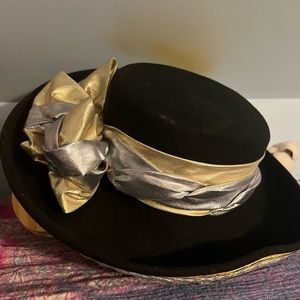 Cute vintage hat. Black with gold and silver bow.